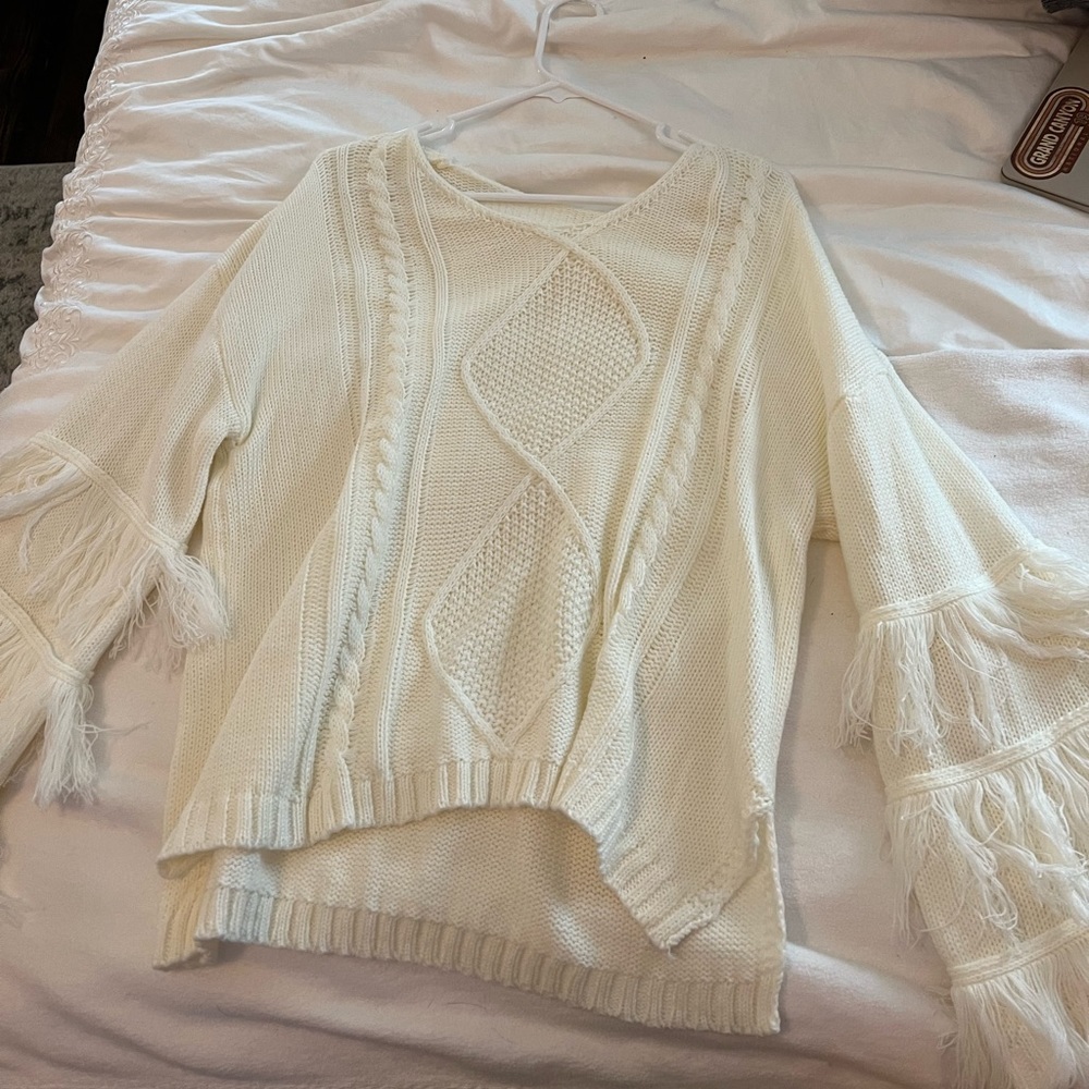 Cream sweater with fringe on sleeves